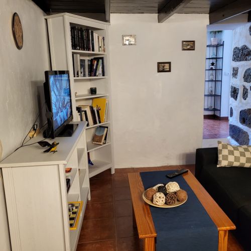 TV cabinet, bookcase and television